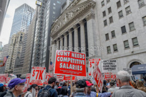 CUNY professors' union march on Wall Street to demand fair contracts